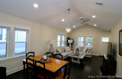 Dining area featuring dark wood-type flooring, lof