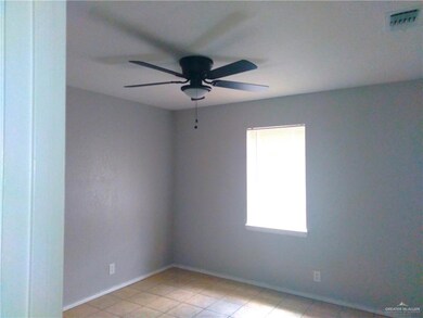 Bedroom featuring a ceiling fan and light tile patterned floors