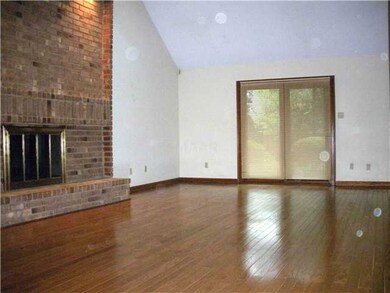 Partial view of the 28x15 Den Fireplace & Hardwood