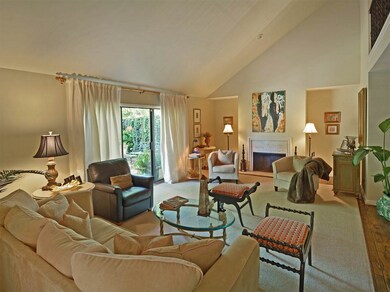 With fireplace and sliding glass door to private g
