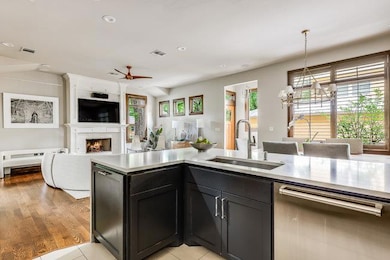Kitchen with dishwasher, a sink, light countertop