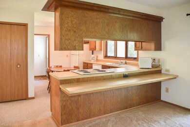 The kitchen has a pantry and a breakfast bar.