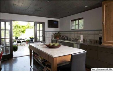 Left view of kitchen with french doors to terrace.