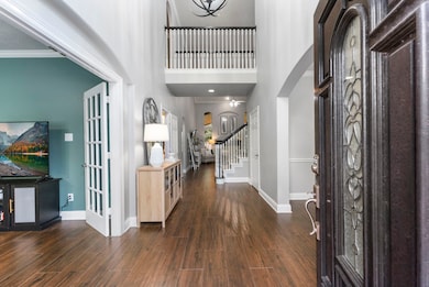 High ceilings, tile floors, and tasteful paint colors create a bright, inviting interior from the moment you enter.