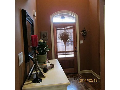 Two story entry. Pretty hardwood floors and smooth ceilings.