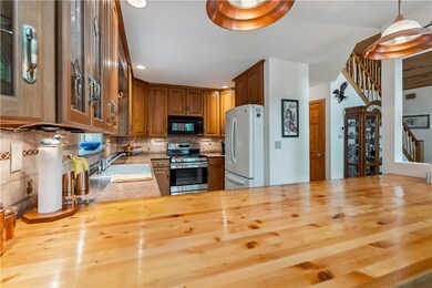 Kitchen with beautiful cabinets and easy flow to d