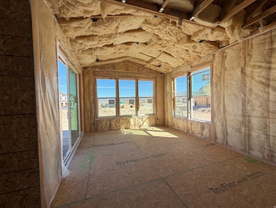 Spare room with vaulted ceiling