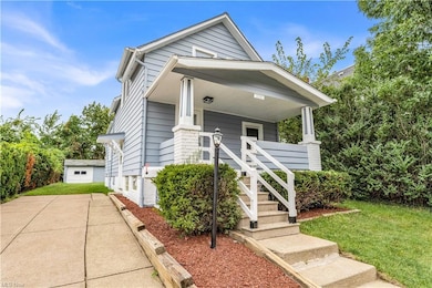 View of front facade with a porch and a front lawn