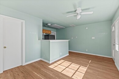 Unfurnished living room with attic access, ceilin