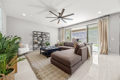 Living room featuring light tile patterned floors,