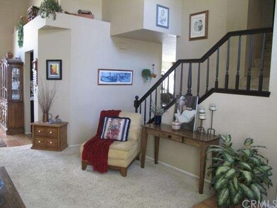 Formal Living Room with beautiful Staircase