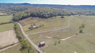 County Road on the acreage used as a drive-way for one home behind all the acreage