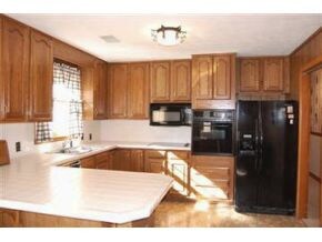 Kitchen with black appliances