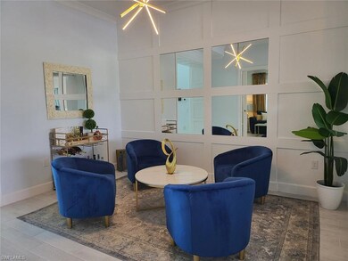 Living area featuring a chandelier, wood finished floors, and ornamental molding