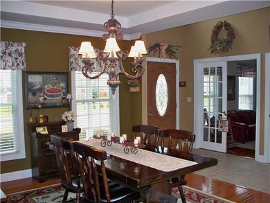 Dining Room. View shows den with french doors.