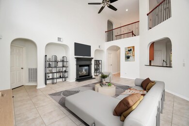 Spacious living room with natural light, featuring