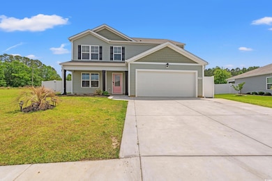 View of front of home with concrete driveway, an a