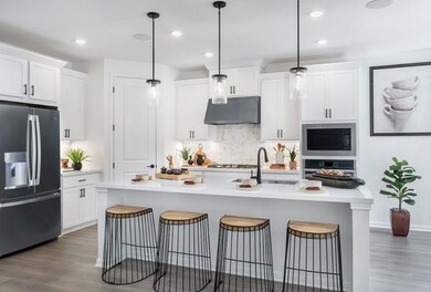 Kitchen featuring tasteful backsplash, appliances