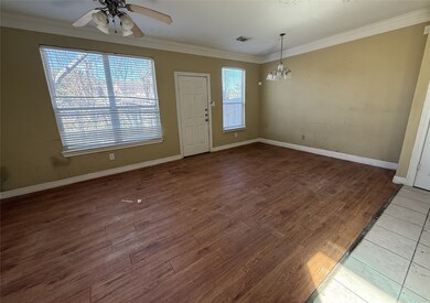 Spacious living space with laminate flooring.