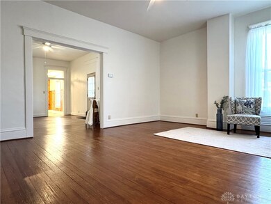 Family room with beautiful hard wood floors.