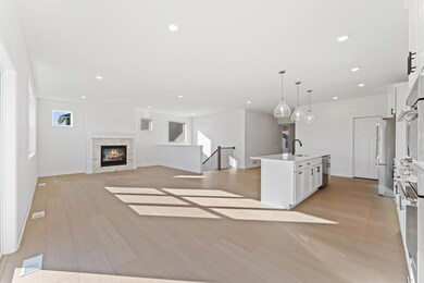 (Photo of an inventory home, actual homes finishes will vary) Cozy up next to the fireplace in your new great room!