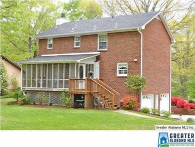 REAR ELEVATION SHOWS SCREENED PORCH AND OPEN DECK FOR GRILLING