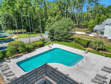 View of swimming pool featuring a yard and a patio