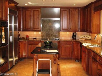 Kitchen. Dream kitchen, with tons of cherry cabinets and breakfast area with granite table top that stays with home.  Kitchen aid applicance, built in refrigerator.  To many updates to list. See attachement for more features.