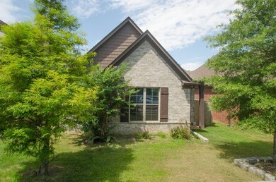 View of home's exterior with a lawn