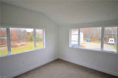 Spacious bedroom with natural light.