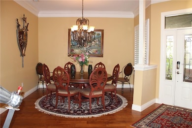 Dining Room & Foyer featuring plantation shutters 