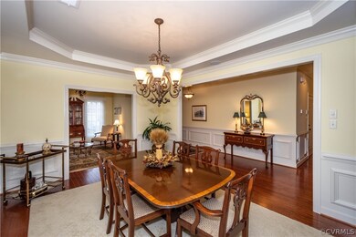 Dining room with tray ceiling, crown moldings, ope