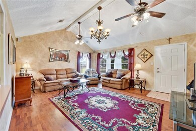 Living Room w/ vaulted ceilings & surround sound