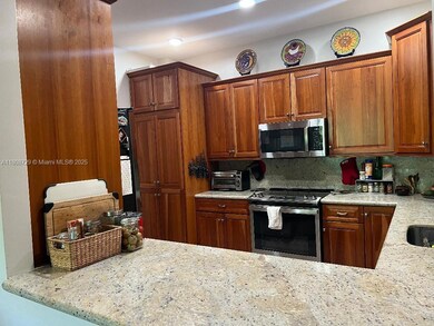 Kitchen range and microwave installed 2024