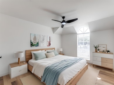 Bedroom with light wood-style flooring and a ceil