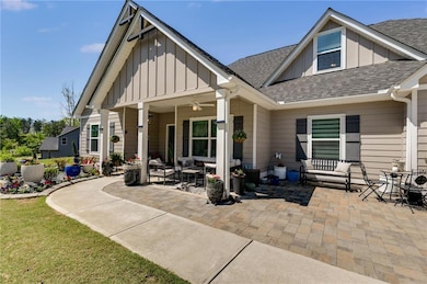 Back of house featuring board and batten siding, a