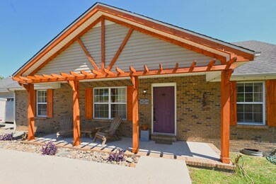 Large covered porch allows you to enjoy the beautiful outdoors rain or shine!