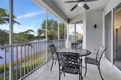 Balcony with a water view and ceiling fan