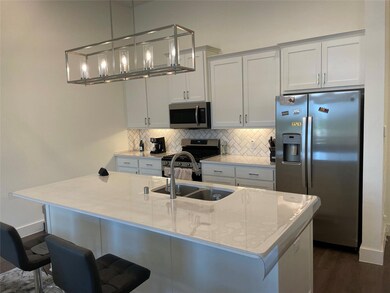 Kitchen featuring dark hardwood / wood-style floor