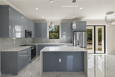 Kitchen with modern cabinets, stainless steel appl