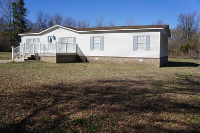 View of front facade with a front lawn, crawl spac