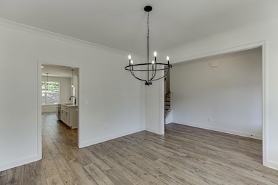 Unfurnished dining area with wood finished floors,