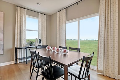 (Photo of a decorated model, actual homes colors and finishes will vary) The eat-in dining room is soaked in beautiful natural light!