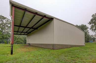 Implement Bay on the back of the shop for protecti