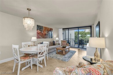 Tiled living room with a chandelier, floor to ceil