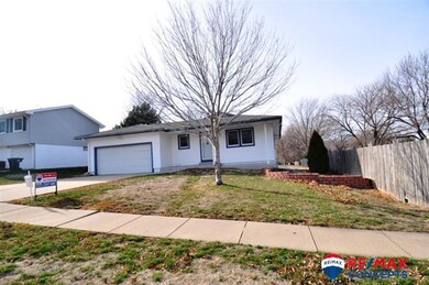The right side yard shows some primary fencing.