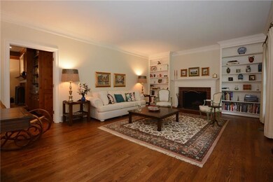 Living room has wonderful built-ins and gleaming h