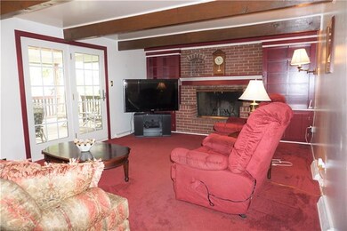 Family Room with log burning fireplace.
