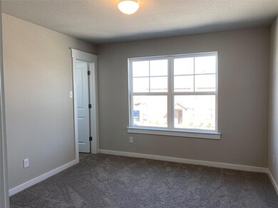 Spare room with plenty of natural light, dark col