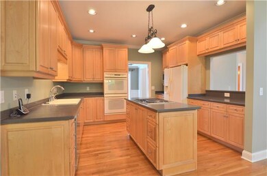 The spacious kitchen has nice raised-panel cabinet